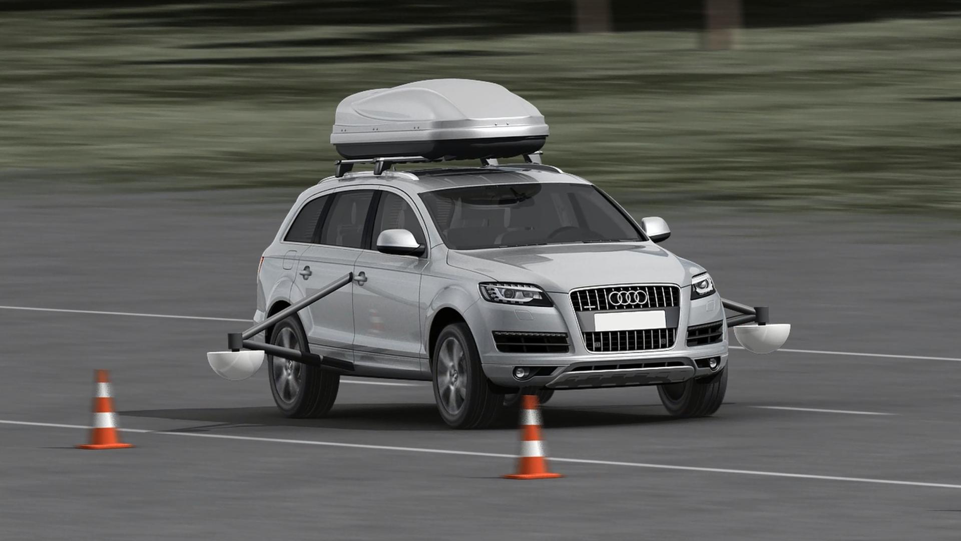 A car with a tilting frame and sensors on the left and right of the doors.
