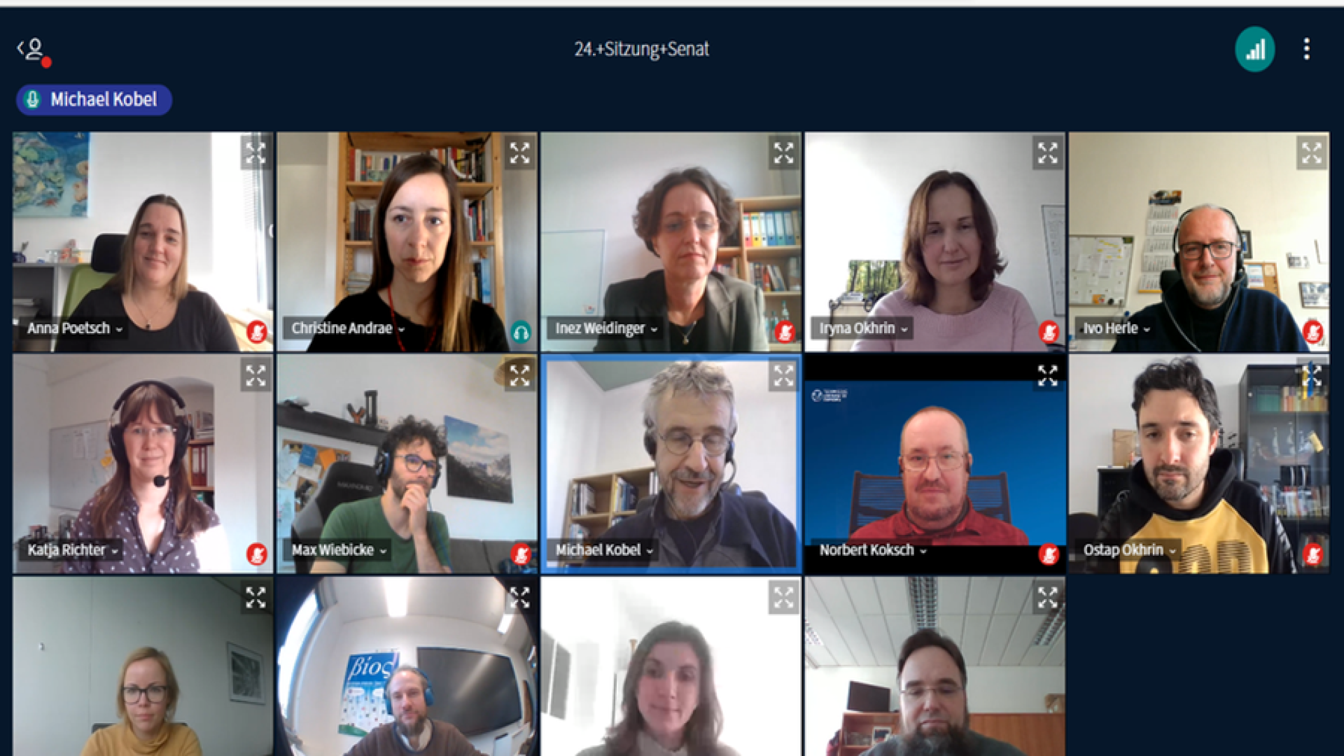 People on a screen in a video conference.