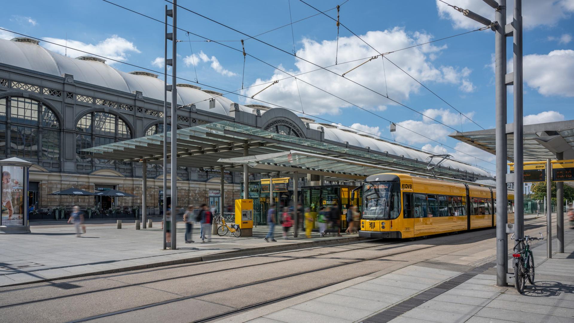 A tram stands at a stop Dresden main station