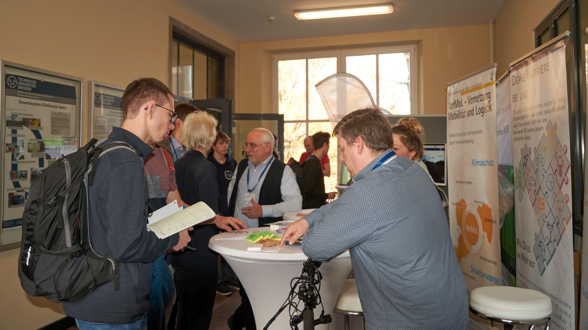 Exhibition stand with people in conversation