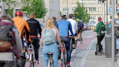 A group of cyclists in the city from behind
