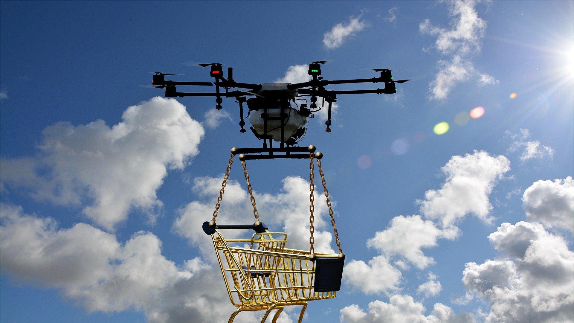 Flying drone with shopping trolley attached below