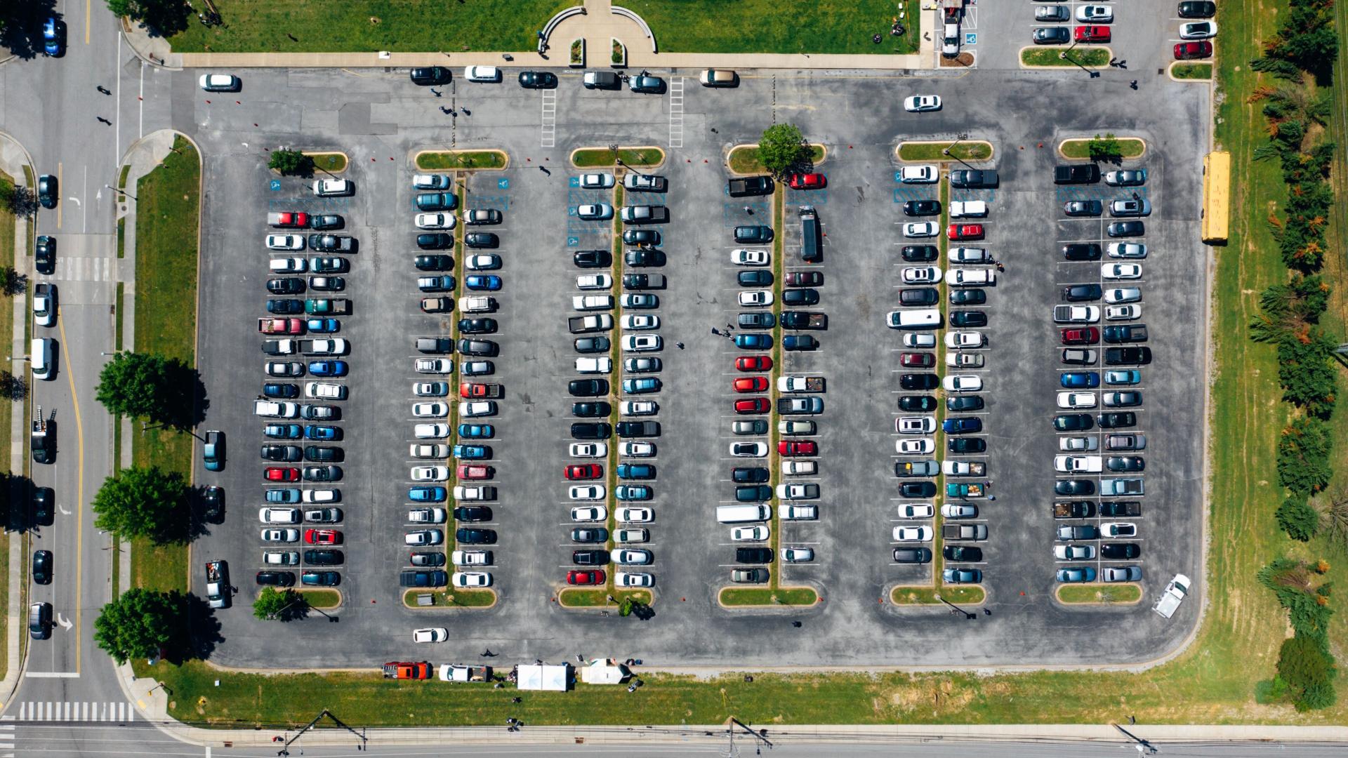Aerial view of car park with many cars