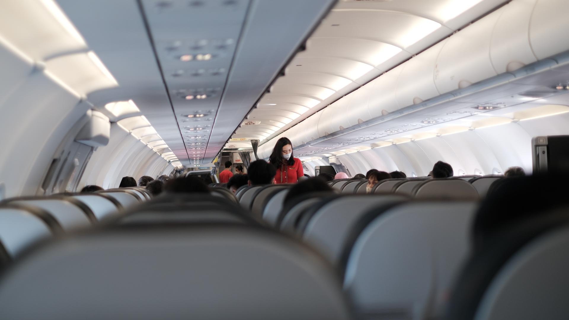 Passengers sitting in an airplane.