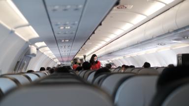 Passengers sitting in an airplane.