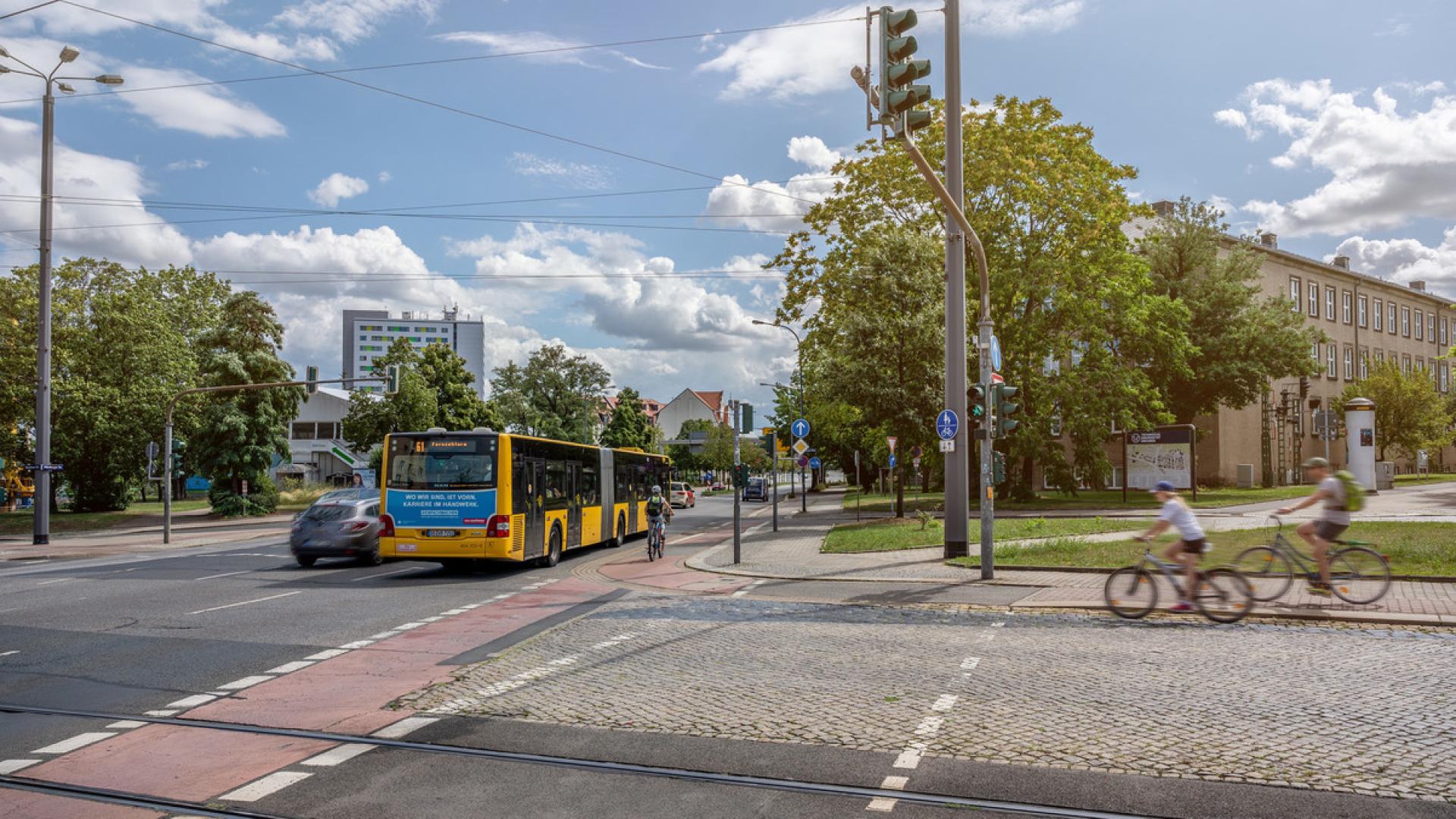 Road crossing with bus stop and cyclists